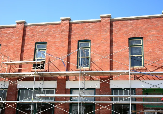 Brick building renovation with scaffolding